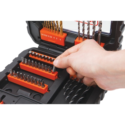 BLACKDECKER A7232 drill and screwdriver bit set in black case, hand selecting a bit, close-up.