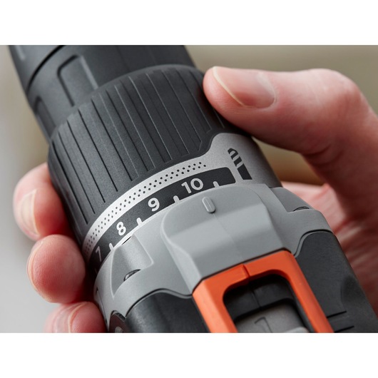 Close-up of BLACKDECKER cordless drill BCD003C1, showing grip, torque settings, and orange accent detail.