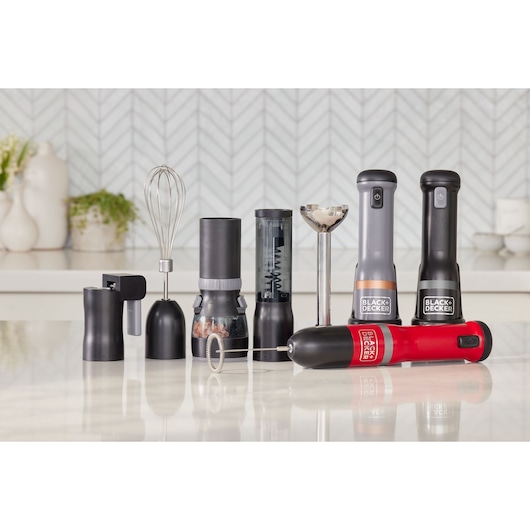 BLACKDECKER BCKM1012KB kitchen hand blender set with various black and red attachments, front view on white background.