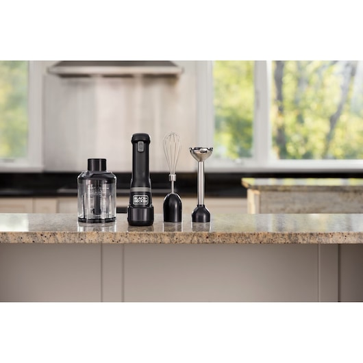 BLACK+DECKER BCKM1013KB hand blender set with whisk, chopper, and blending attachments on kitchen counter.