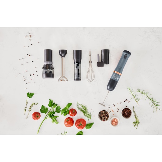 BLACKDECKER BCKM1016KSG hand blender set with black attachments and fresh vegetables on white background, top view.