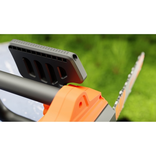 Close-up photo of BLACKDECKER BECS2245 chainsaw handle and safety guard with orange and black details, outdoor background.