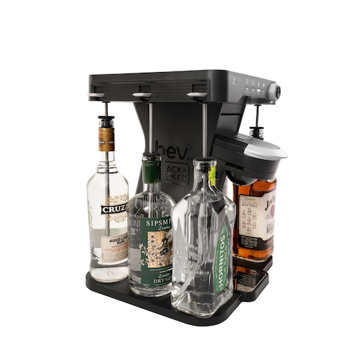 BLACK+DECKER BEHB101 cocktail maker with four liquor bottles, angled view on white background.