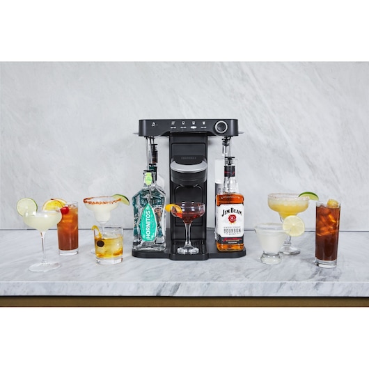 BLACKDECKER BEHB101 black cocktail maker with multiple mixed drinks, Hornitos tequila, and Jim Beam bourbon, front angle.