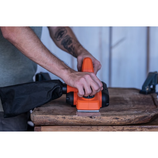Photo of BLACKDECKER BEW712 power sander in use on wooden surface