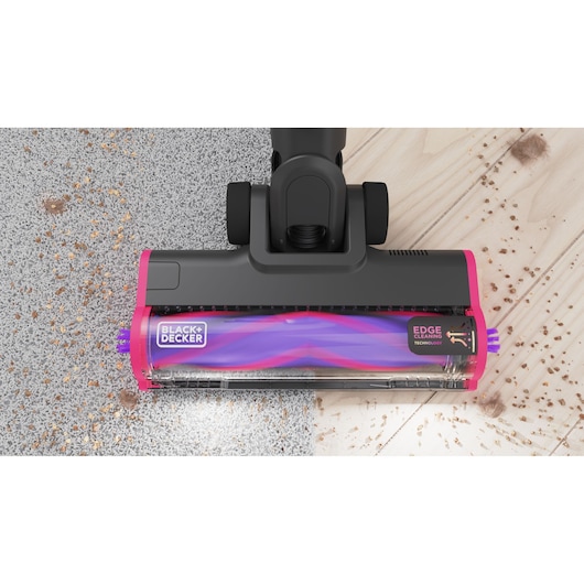 BLACKDECKER BHFEA640WP vacuum head top view on carpet and wood with debris, edge cleaning feature.