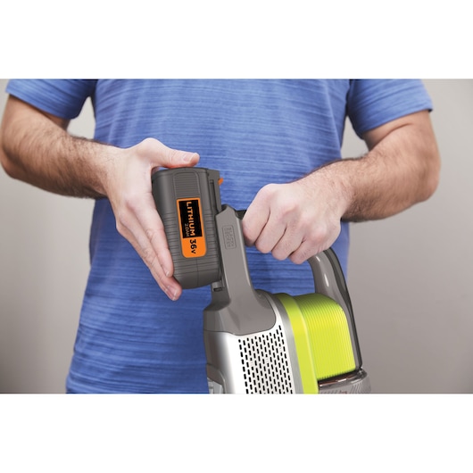 BLACKDECKER BHFEV362DA cordless vacuum cleaner with 36V lithium battery being installed, close-up view.