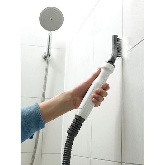 Photo of BLACKDECKER BHSM1615DSG steam cleaning brush cleaning shower tile grout.
