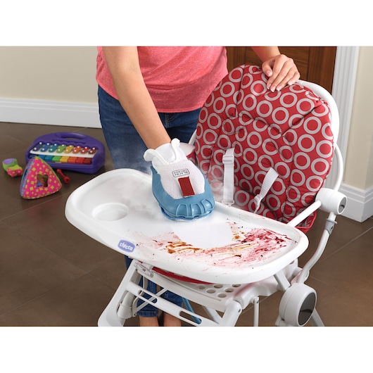 BLACKDECKER BHSM1615DSG steam cleaning glove cleaning a stained high chair tray in a kitchen setting.