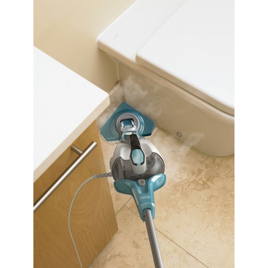 BLACKDECKER BHSM166DSM steam mop cleaning bathroom tile near toilet, blue and grey, top view.