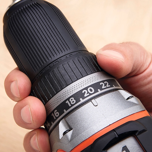 Close-up of BLACKDECKER BL186N cordless drill torque adjustment ring held in hand, showing numbered settings.